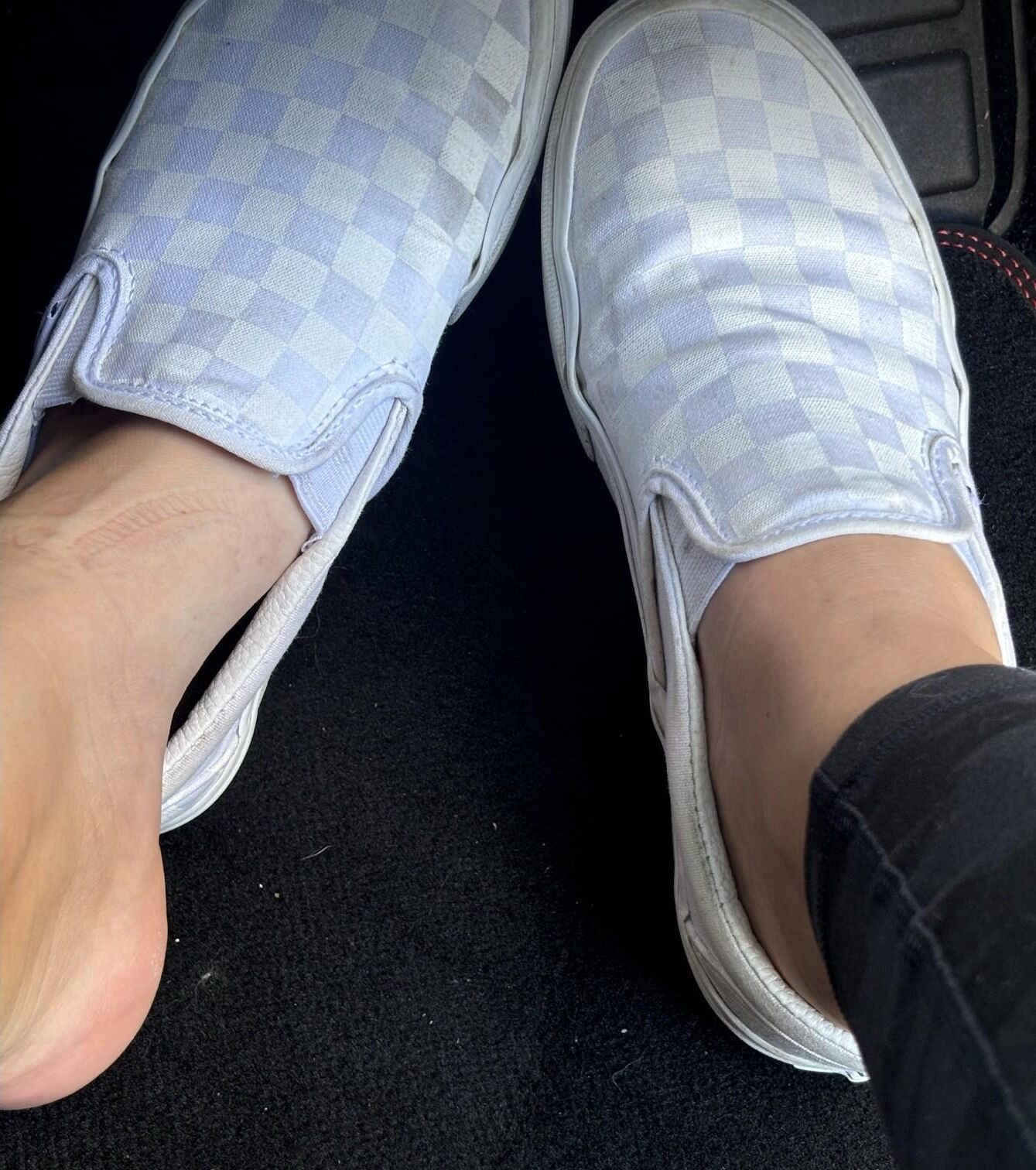 Ash removes her sweaty Vans in the car to show her toes