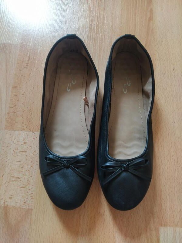 Worn ballerinas 