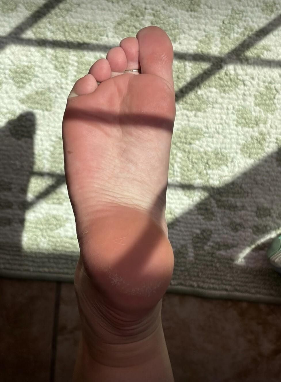 Ash’s sweaty feet in the sunlight 