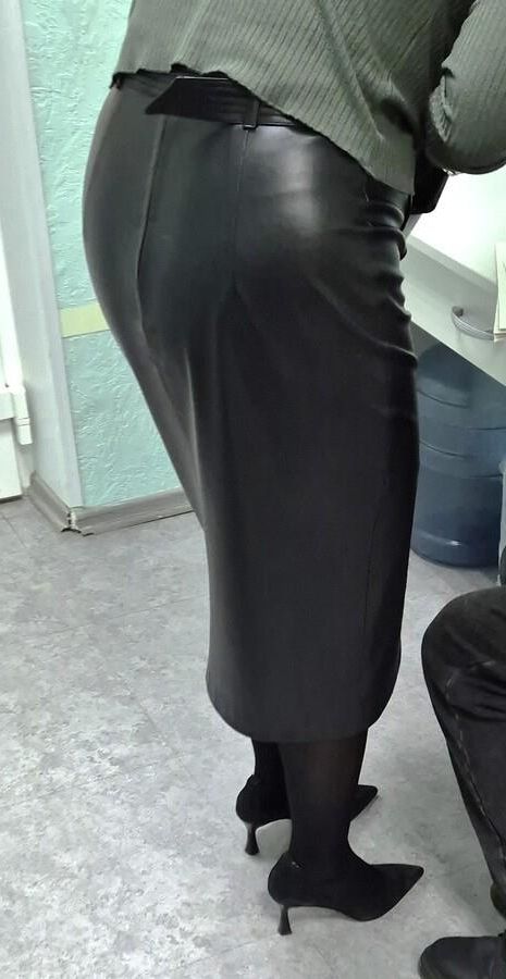 Co worker in leather skirt and suede heels