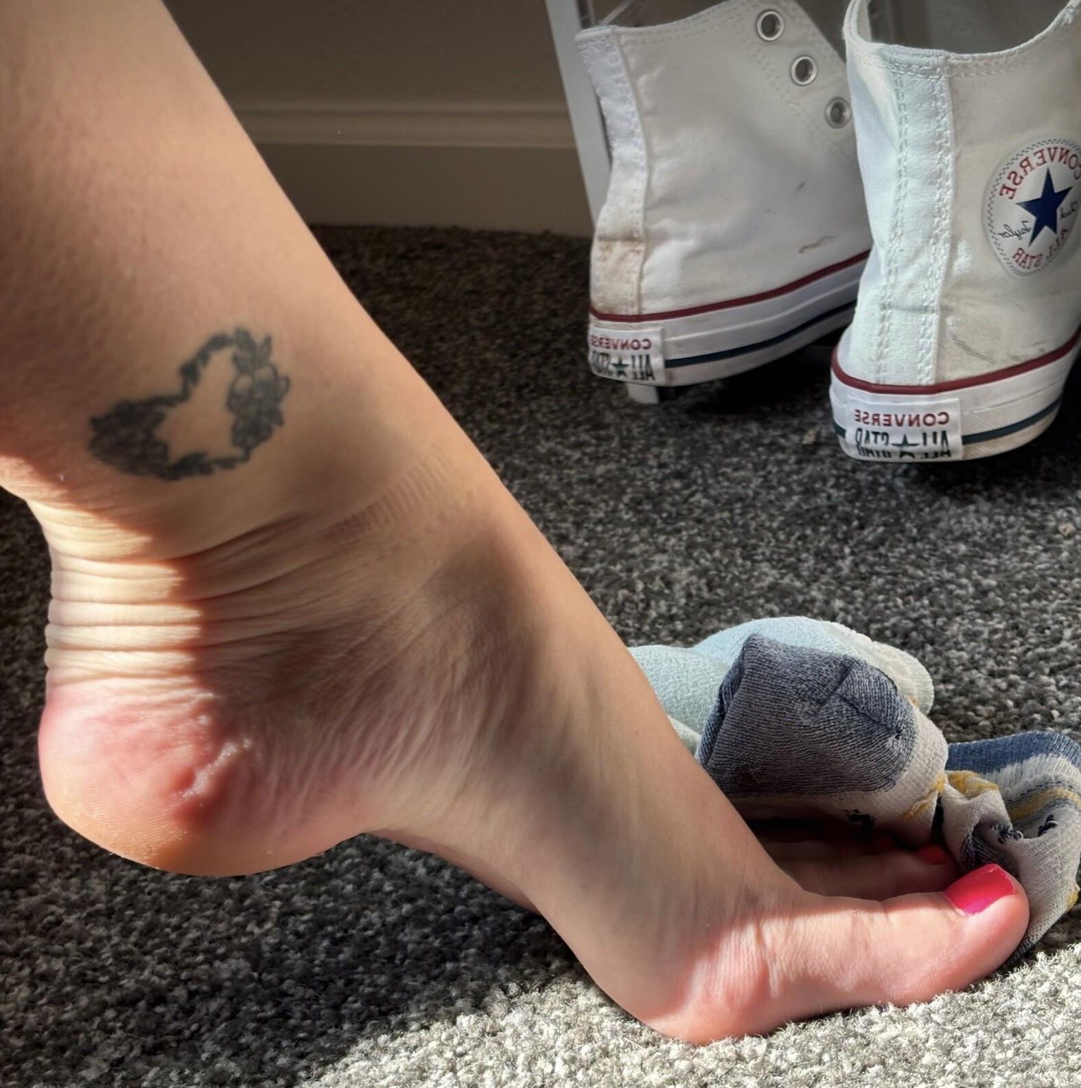 Ash removing socks to show her perfect toes