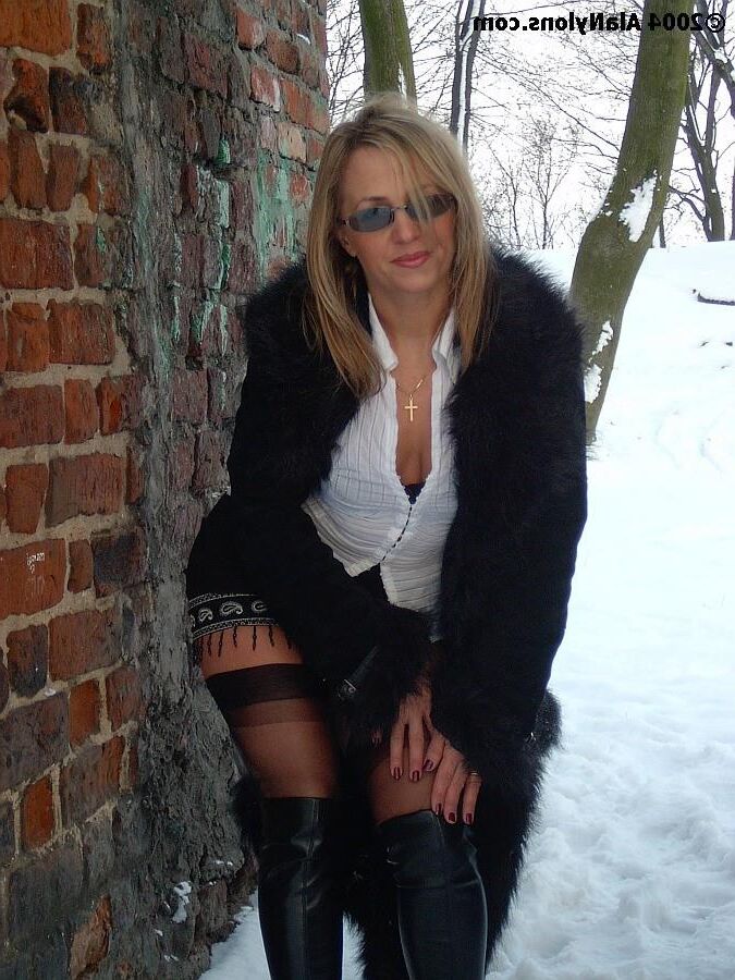 Fur coat, nylons and boots in the snow