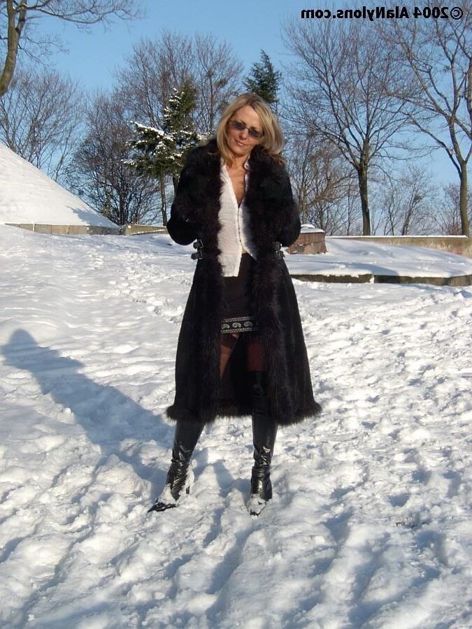 Fur coat, nylons and boots in the snow