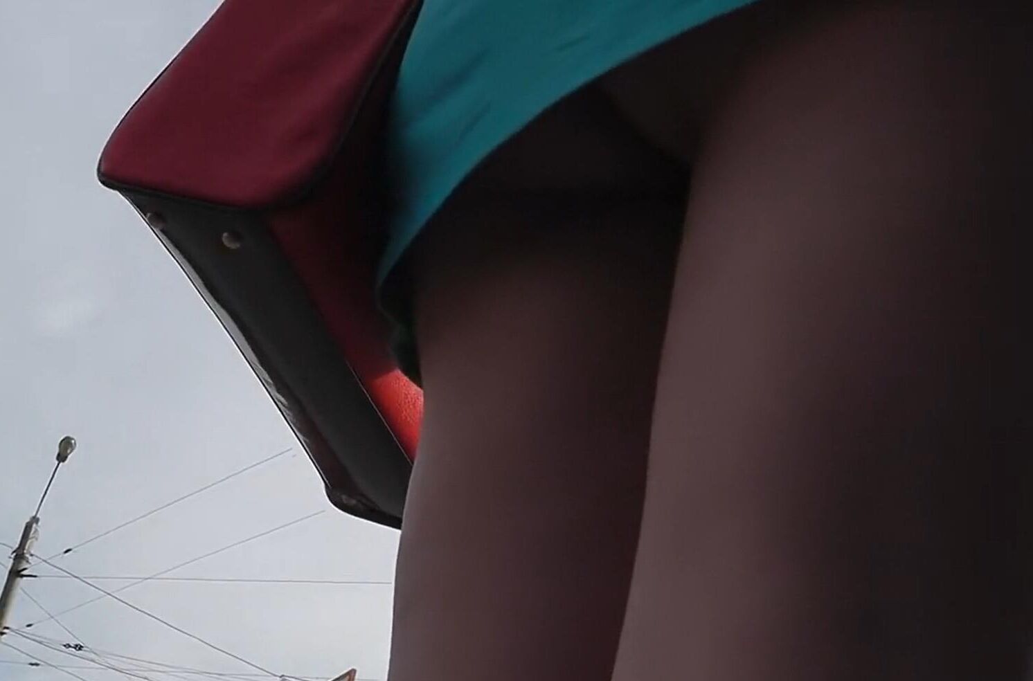 Brunette in red heels under the dress