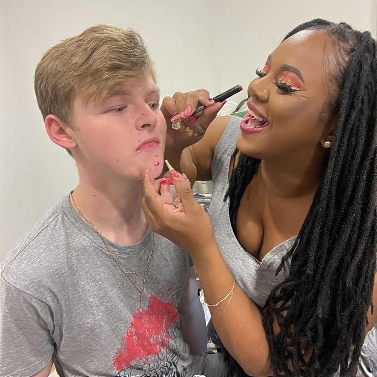 Black women feminizing white boys with lipstick