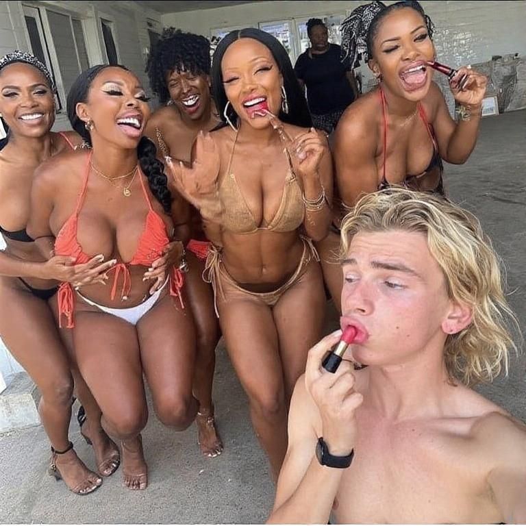 Black women feminizing white boys with lipstick
