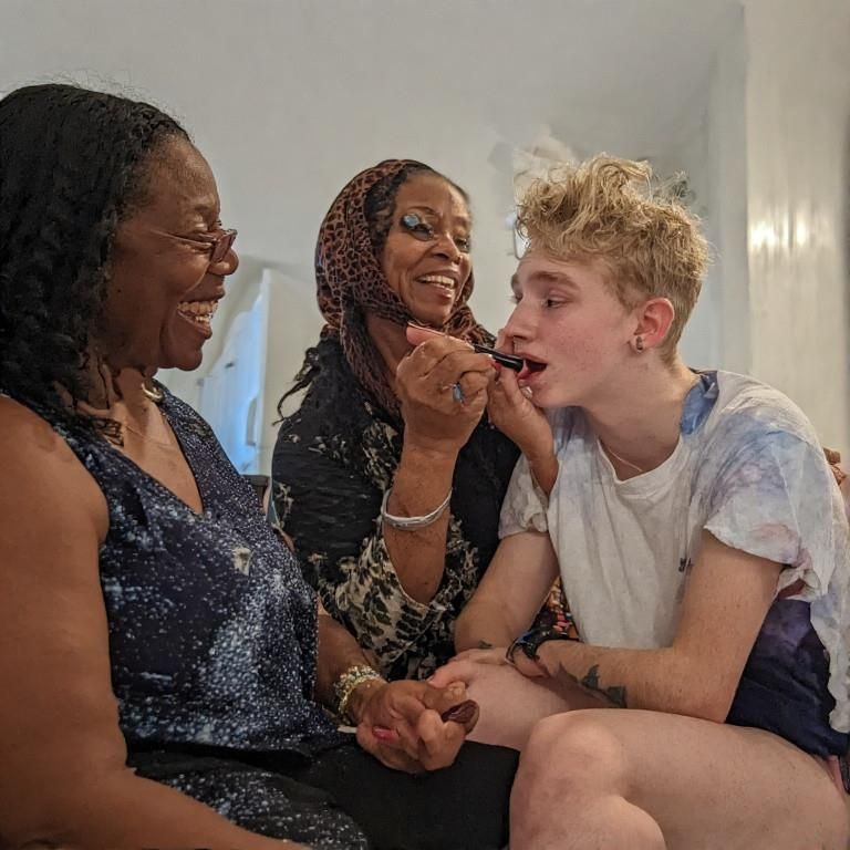 Black women feminizing white boys with lipstick