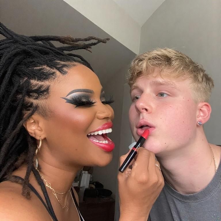 Black women feminizing white boys with lipstick