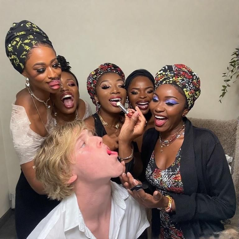 Black women feminizing white boys with lipstick