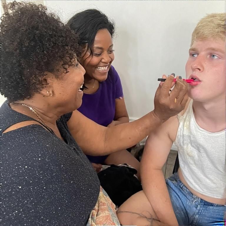 Black women feminizing white boys with lipstick