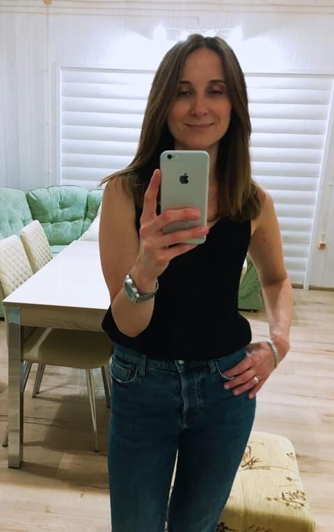 Black sleeveless tops and metal wristwatches #