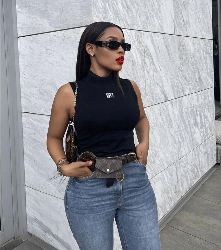 Black sleeveless tops and metal wristwatches #