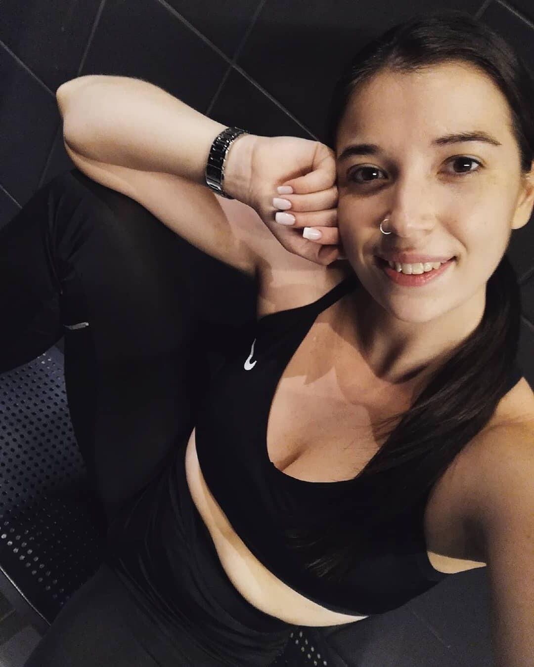 Black sleeveless tops and metal wristwatches #