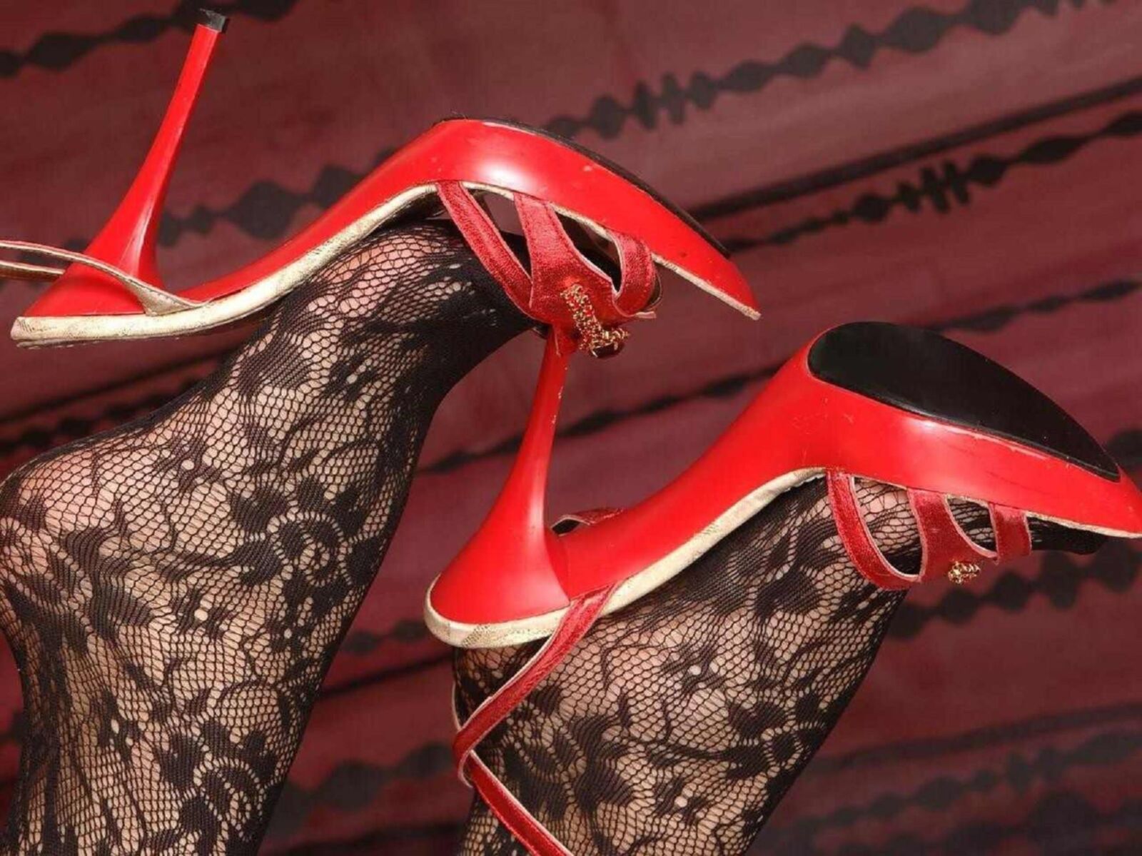feet close ups in fishnets and shoes 