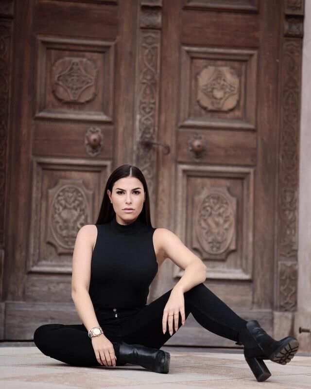 Black sleeveless tops and metal wristwatches #