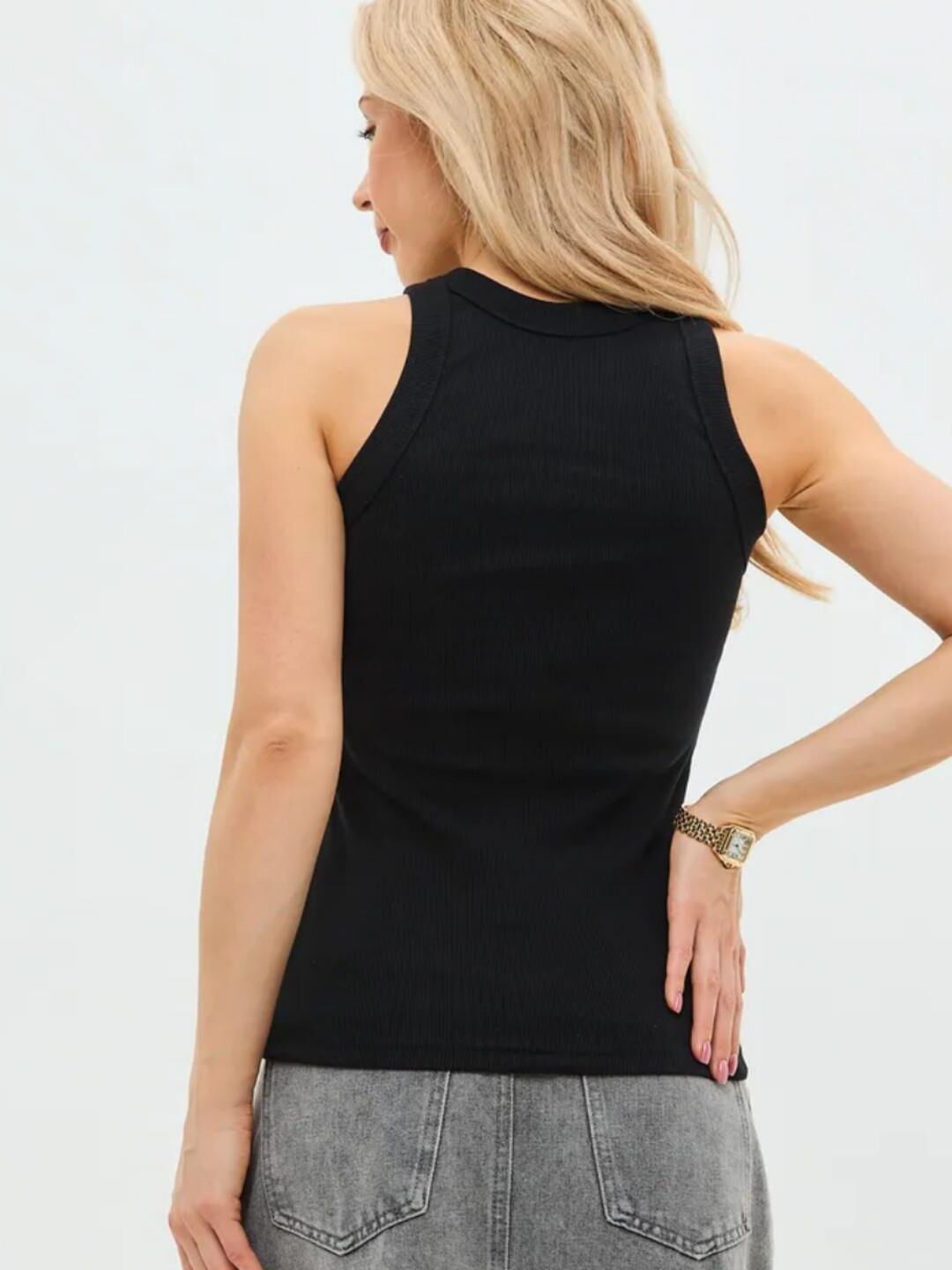 Black sleeveless tops and metal wristwatches #