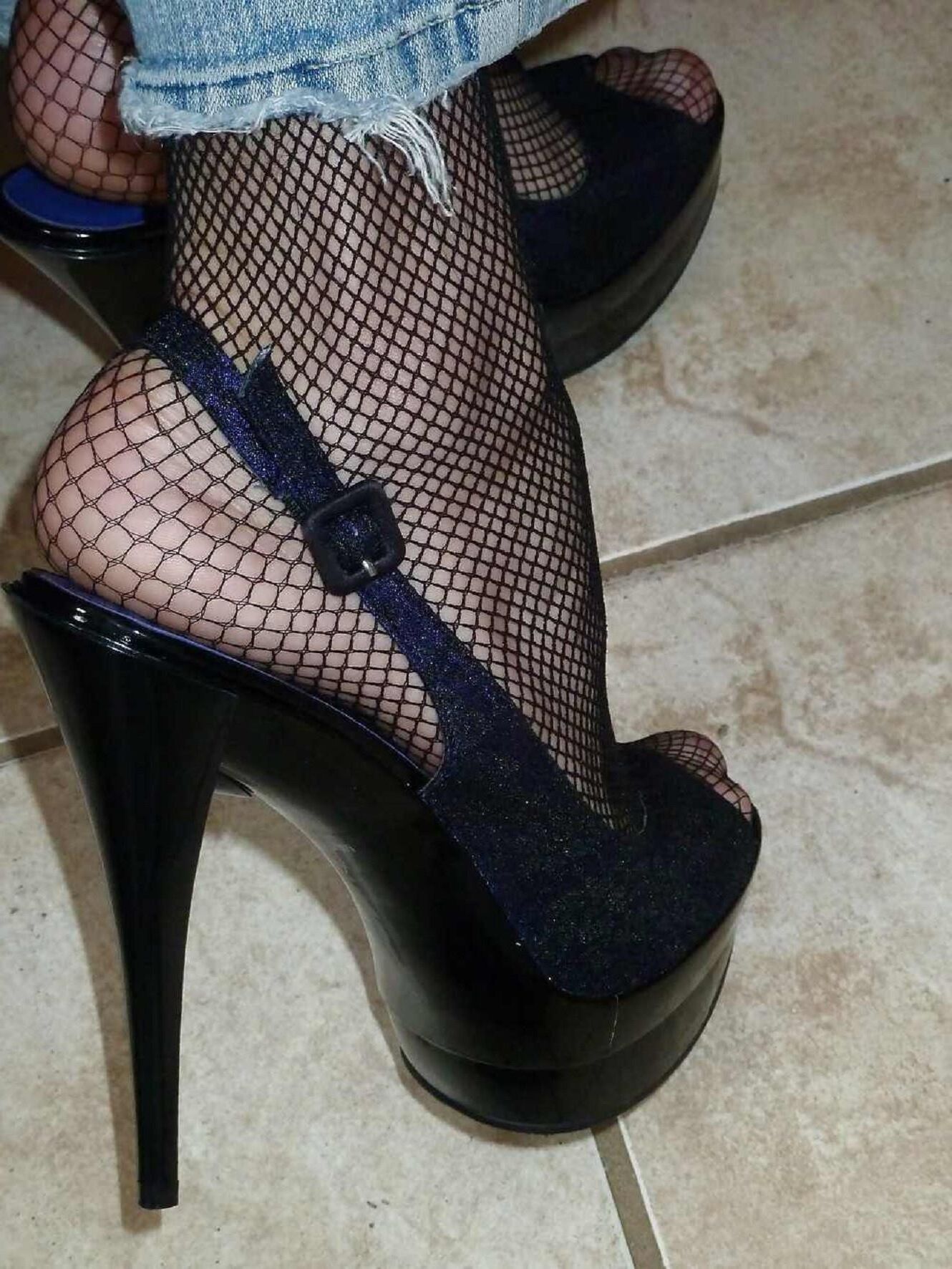 feet close ups in fishnets and shoes 