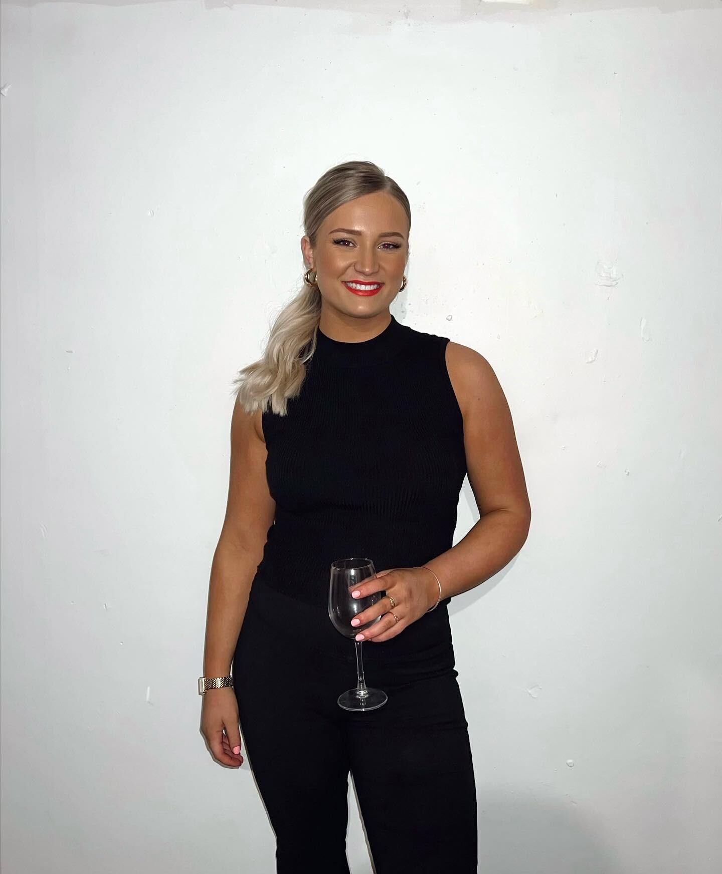 Black sleeveless tops and metal wristwatches #