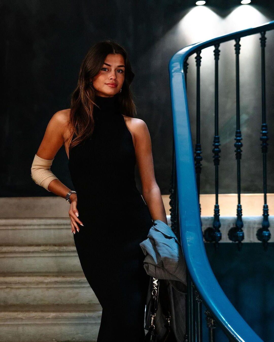 Black sleeveless tops and metal wristwatches #