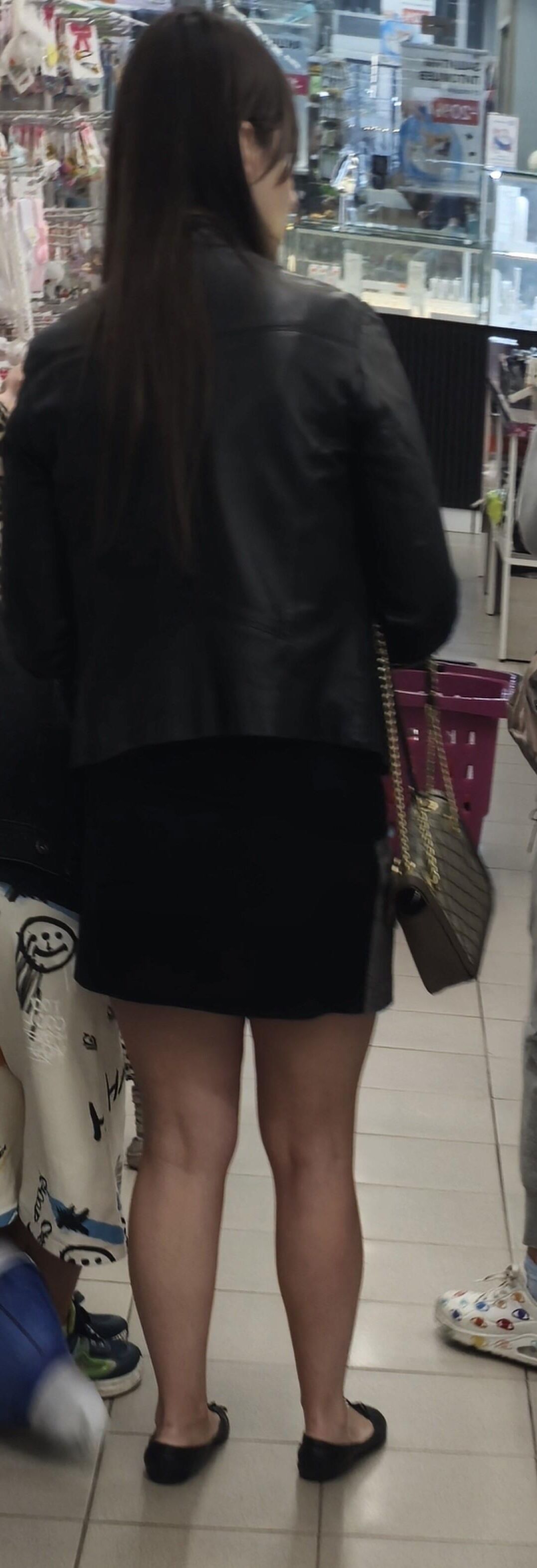 Girl in mini skirt and ballerinas shoes