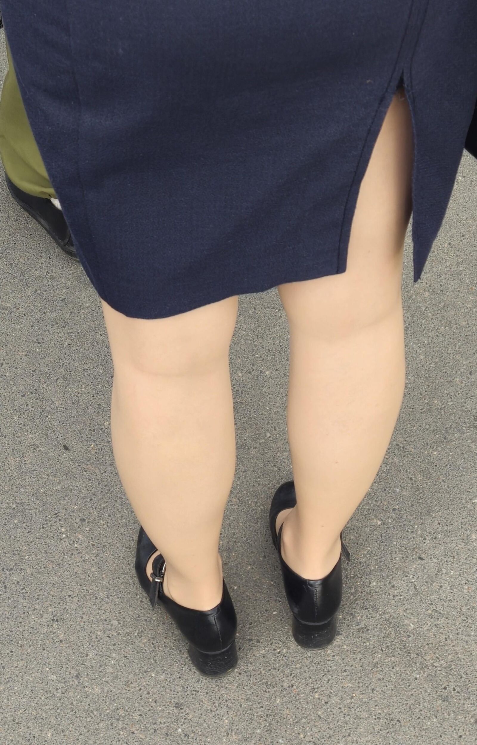 Woman in midi skirt and nude pantyhose