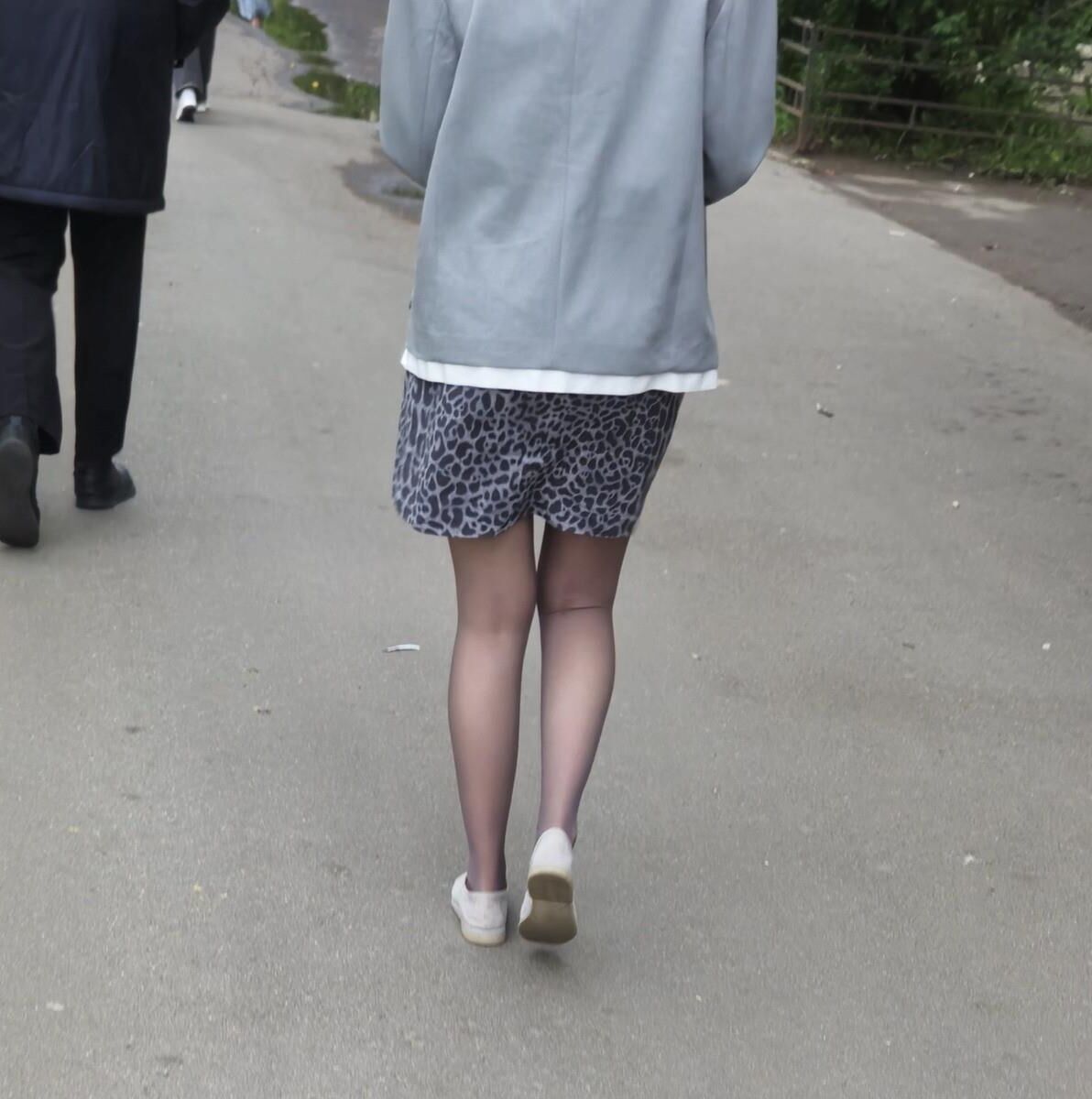 Woman in brown pantyhose and skirt
