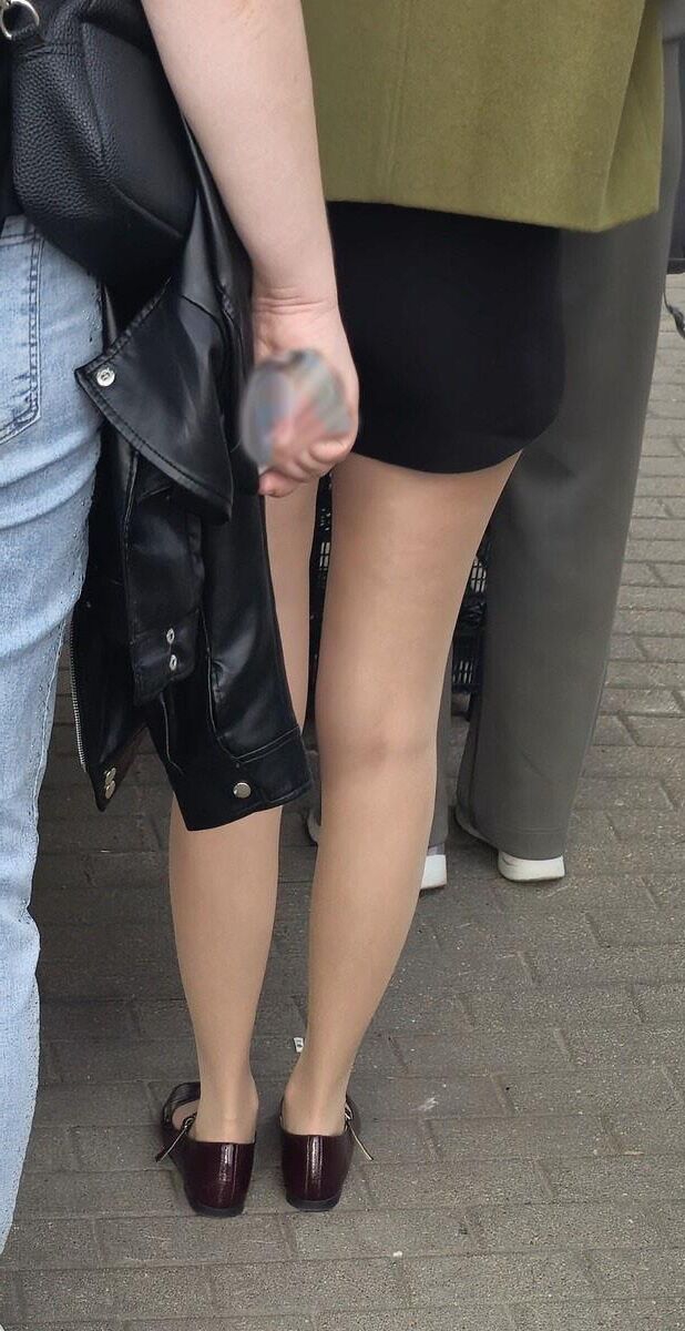 Girl in shorts, nude pantyhose and ballerinas shoes