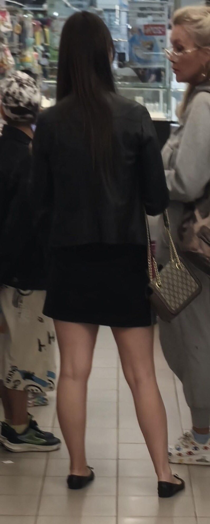 Girl in mini skirt and ballerinas shoes