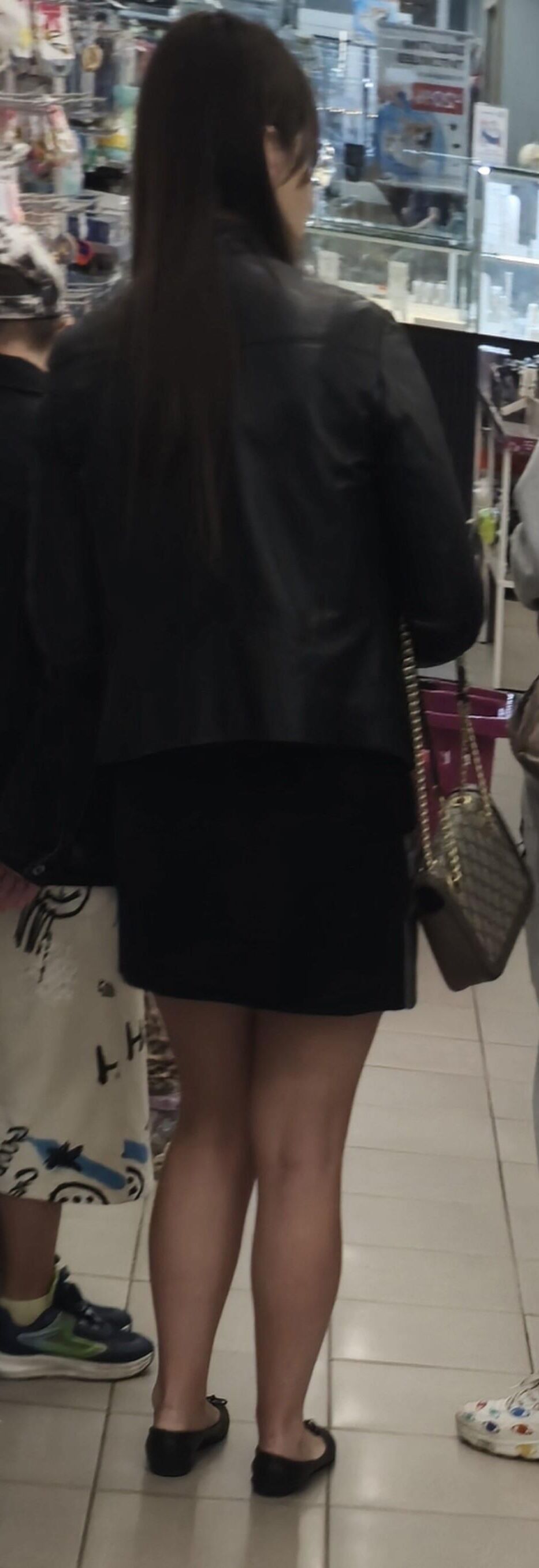 Girl in mini skirt and ballerinas shoes