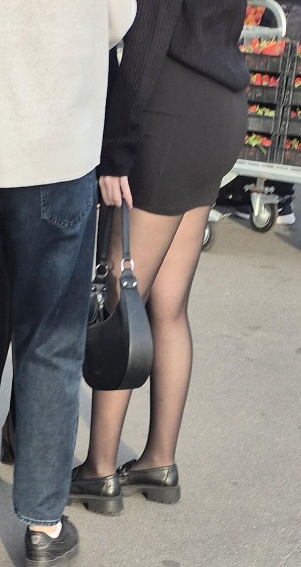 Girl in mini skirt and black pantyhose