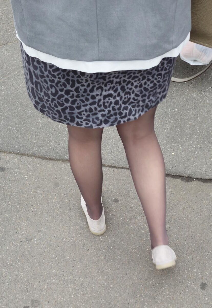 Woman in brown pantyhose and skirt