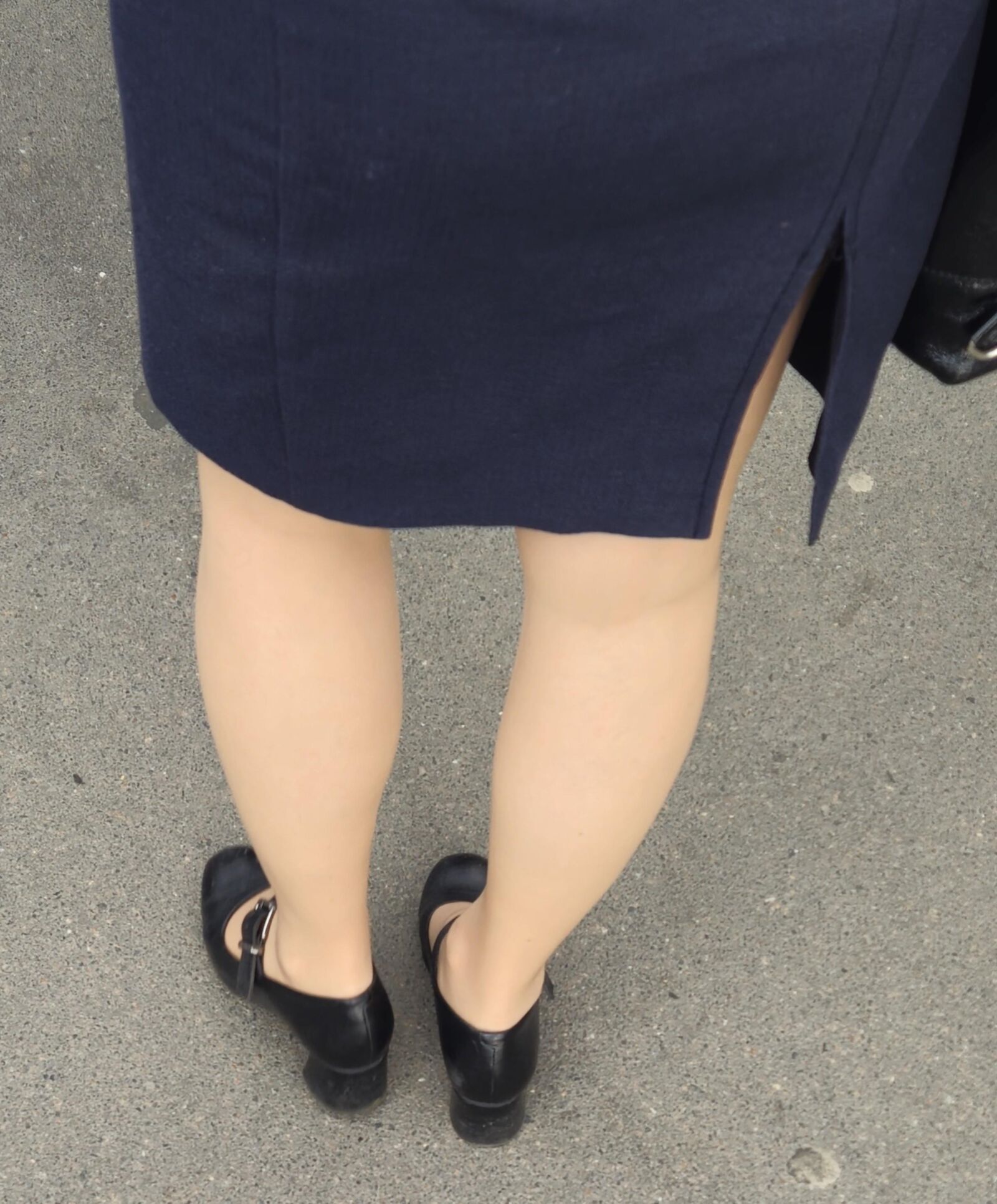 Woman in midi skirt and nude pantyhose