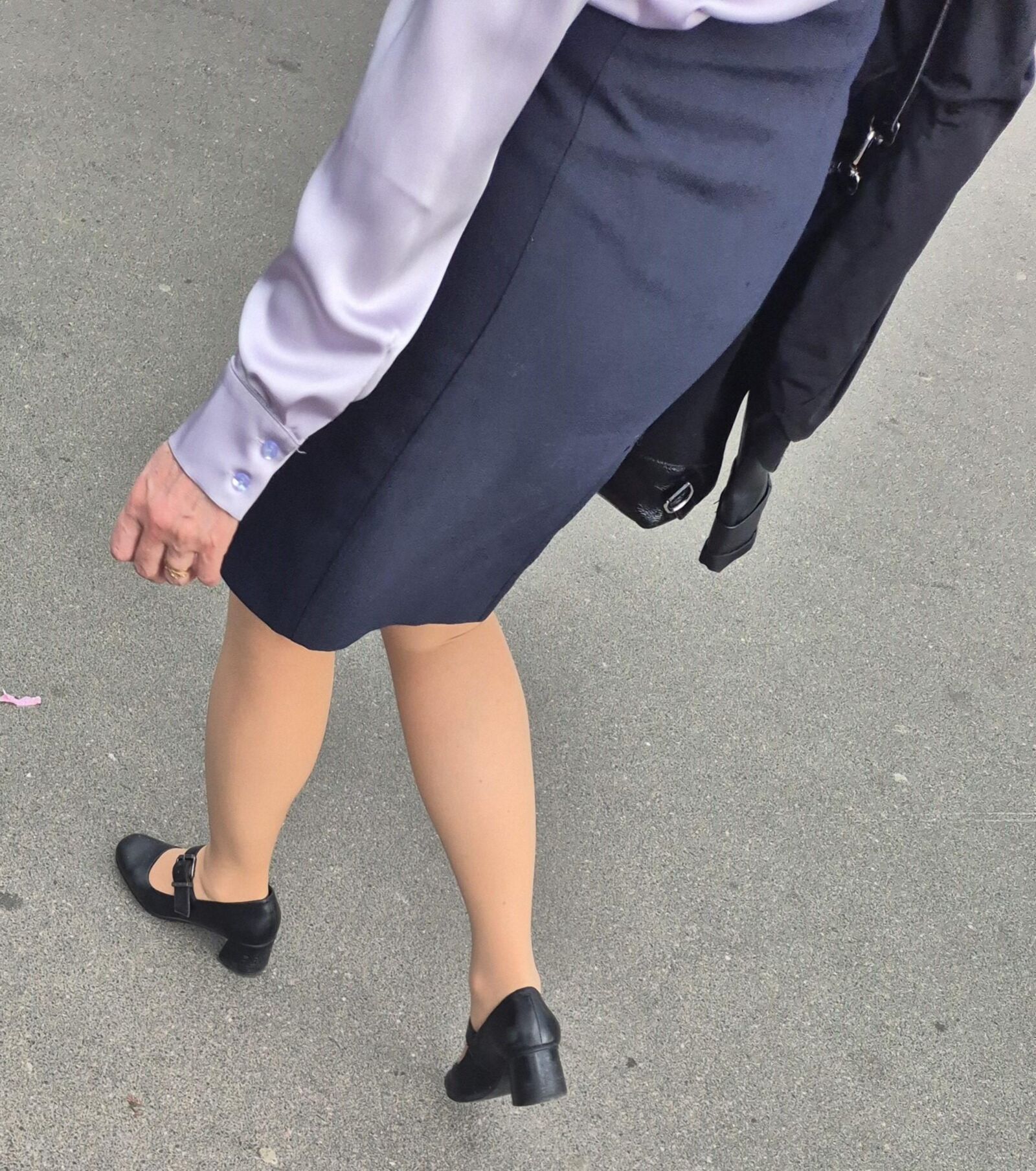 Woman in midi skirt and nude pantyhose