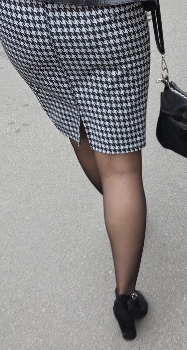 Business woman in midi skirt, pantyhose and suede heels