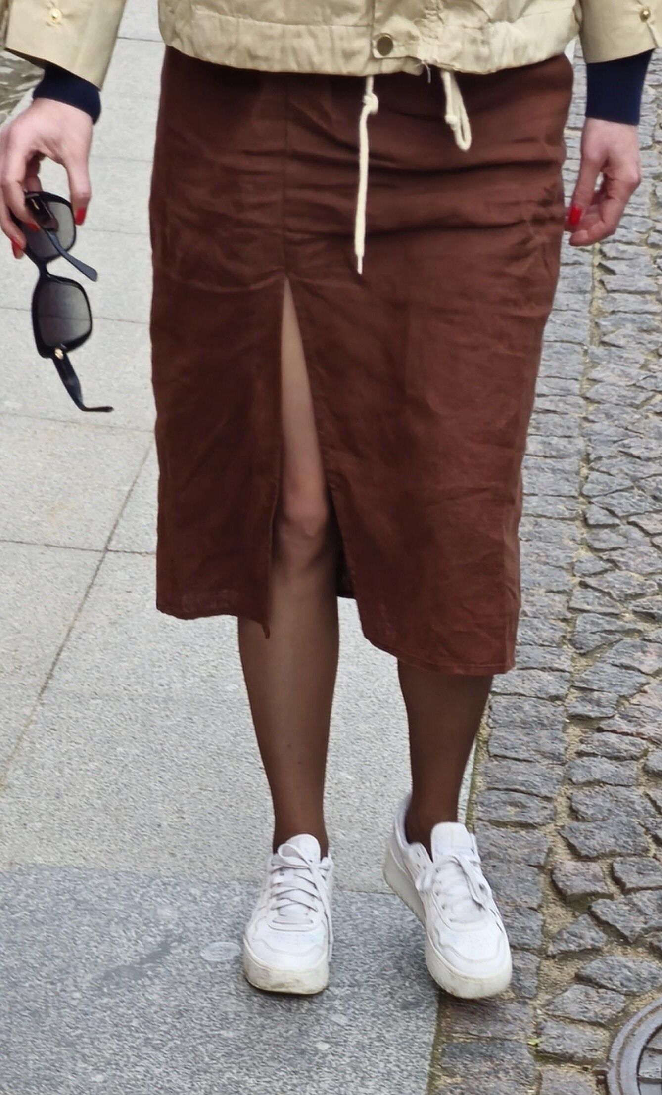 Girl in long skirt and brown pantyhose