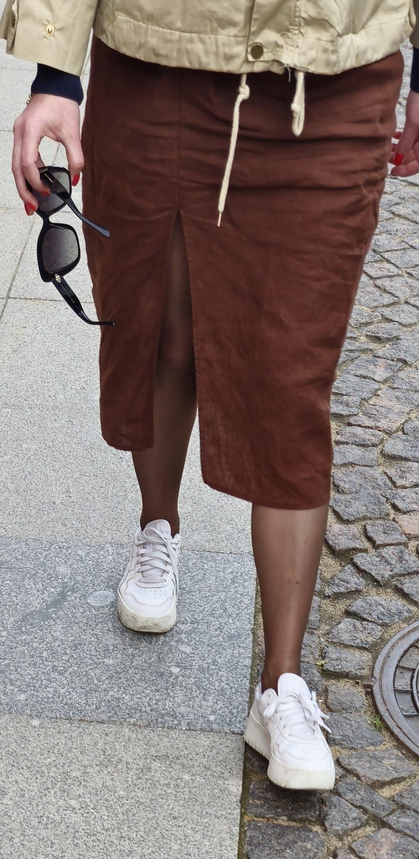 Girl in long skirt and brown pantyhose