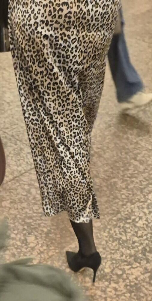 Woman in long leopard print skirt