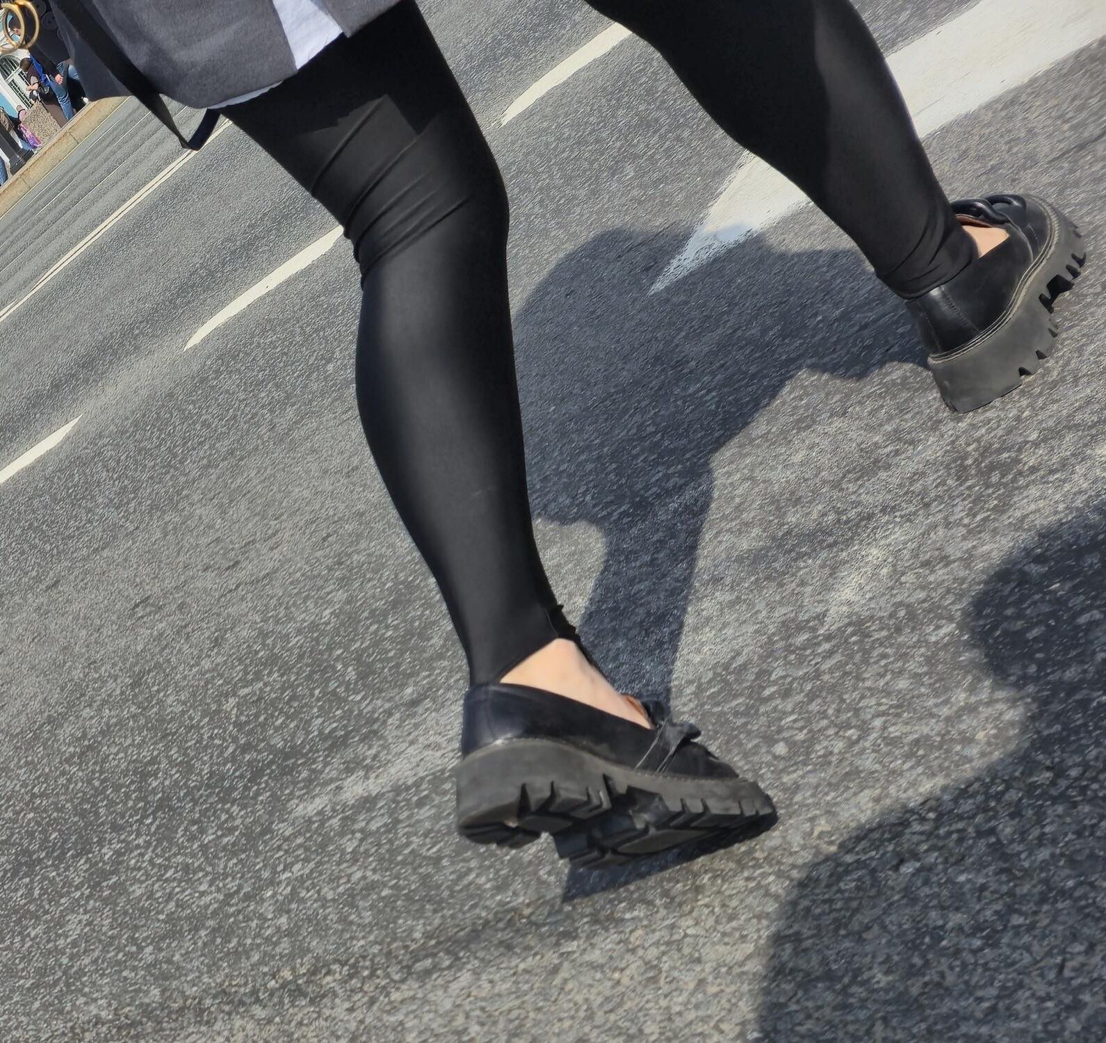 Girl in jacket and black leggins