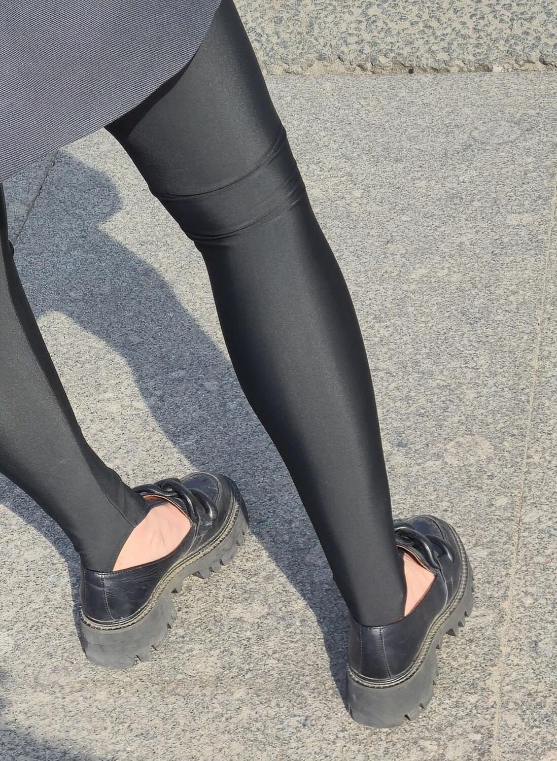 Girl in jacket and black leggins