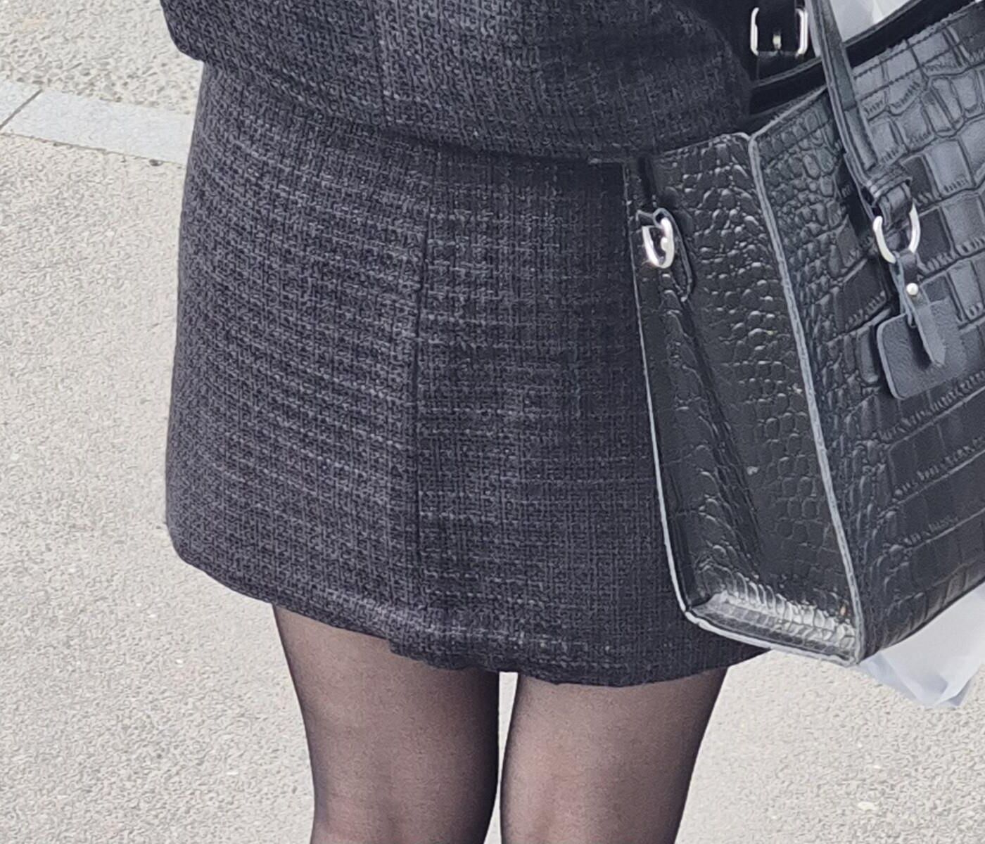 Girl in black pantyhose and mini skirt