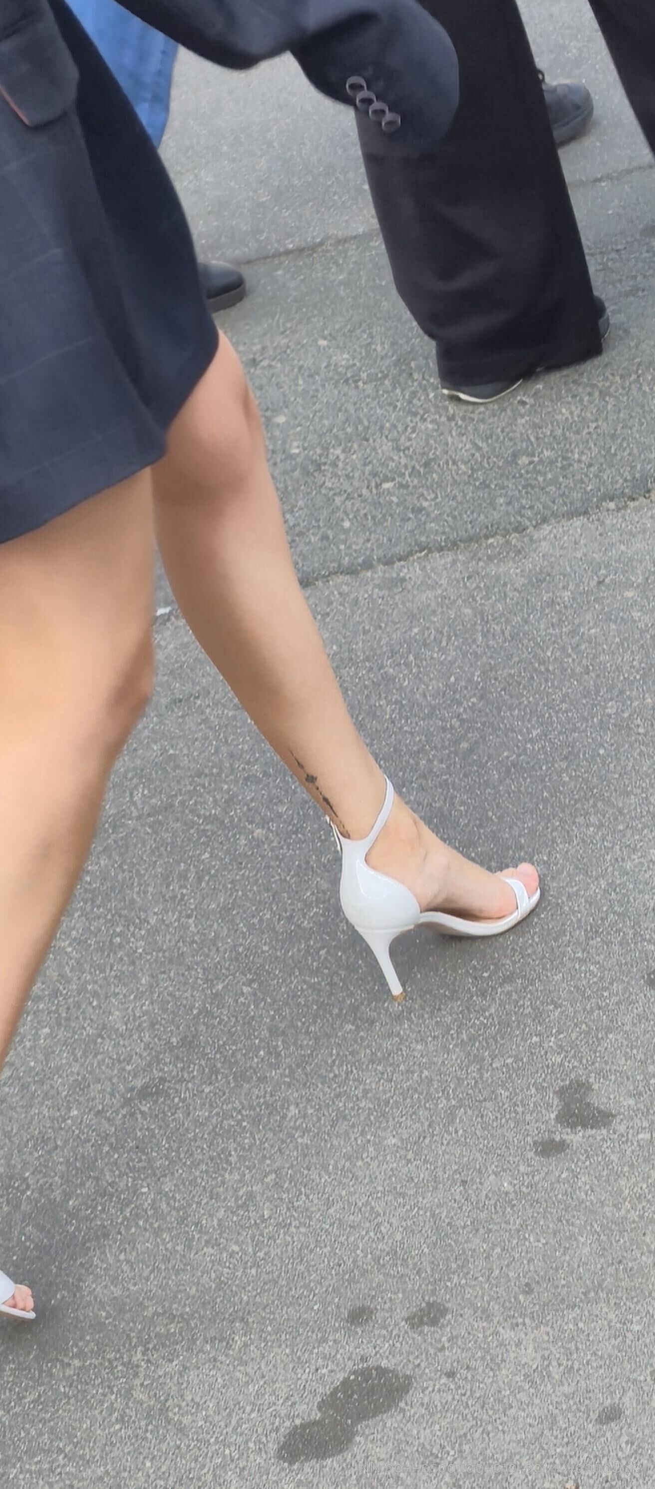 Girl in white sandal heels