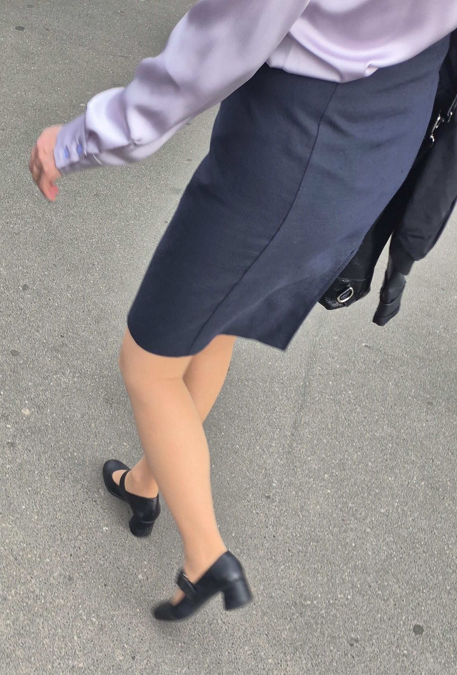Woman in midi skirt and nude pantyhose