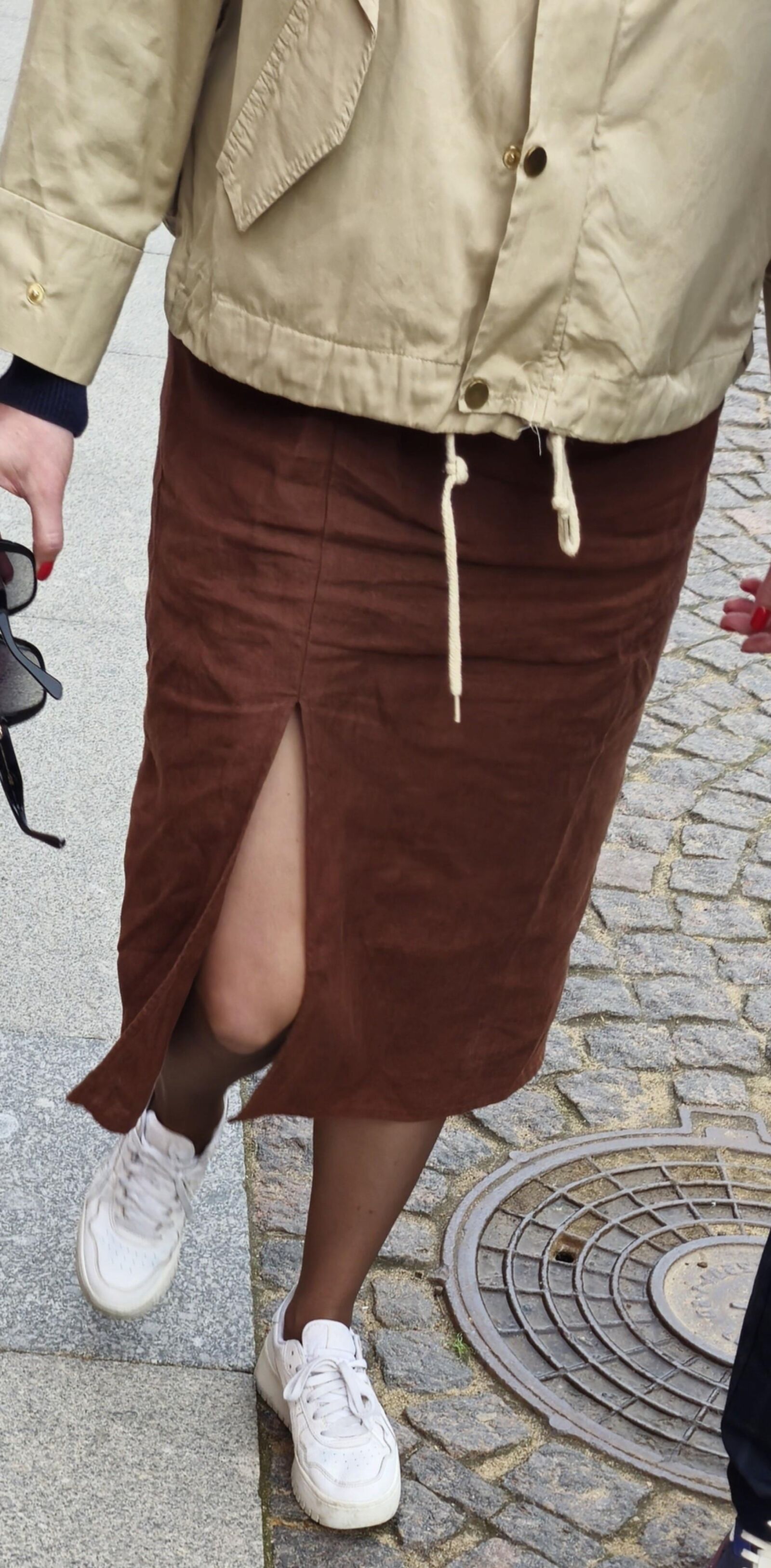 Girl in long skirt and brown pantyhose