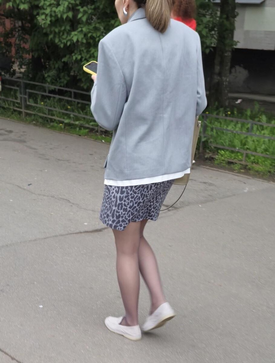 Woman in brown pantyhose and skirt