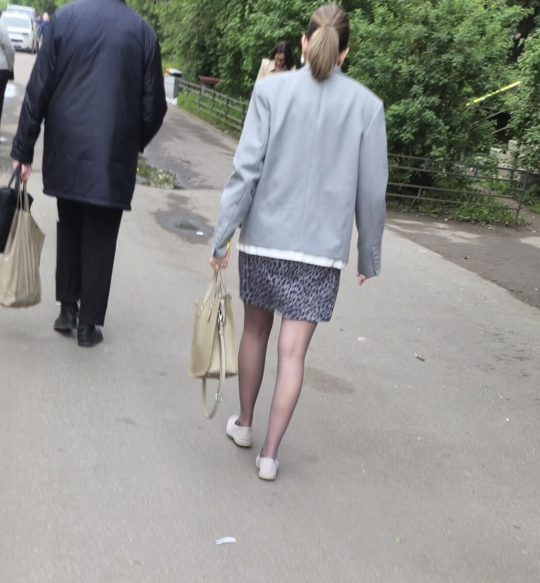 Woman in brown pantyhose and skirt