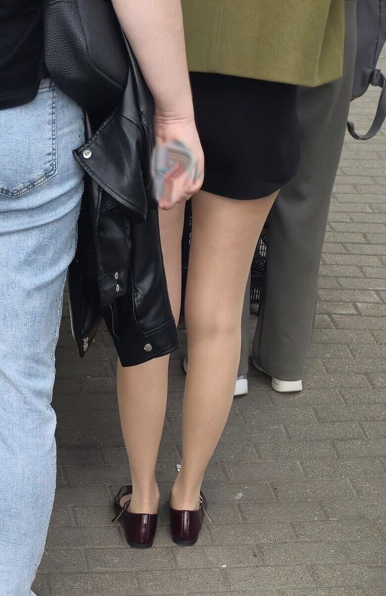 Girl in shorts, nude pantyhose and ballerinas shoes