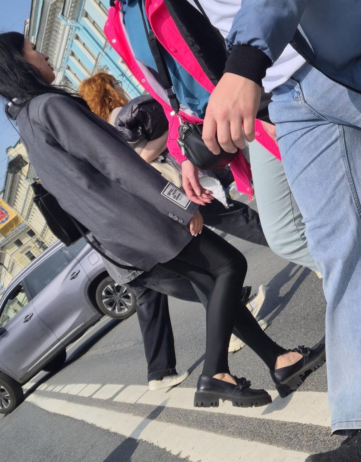Girl in jacket and black leggins