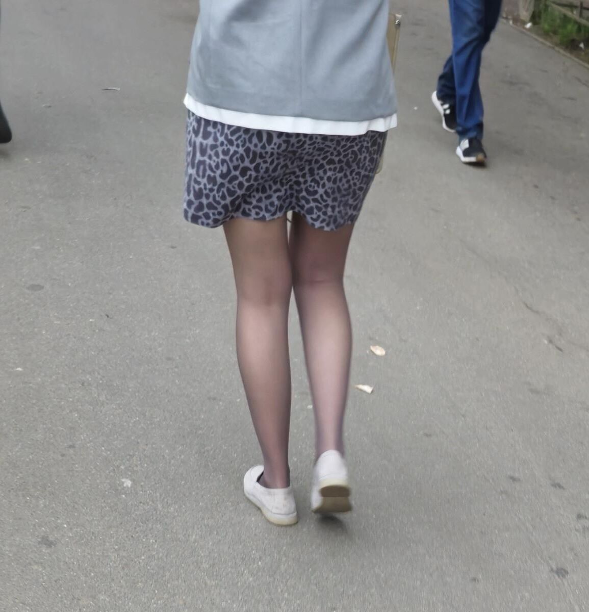 Woman in brown pantyhose and skirt