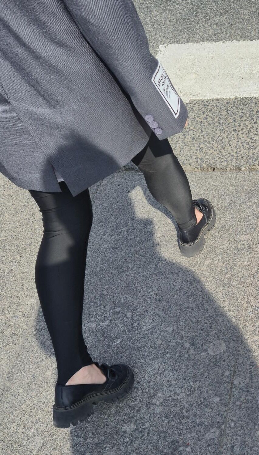 Girl in jacket and black leggins