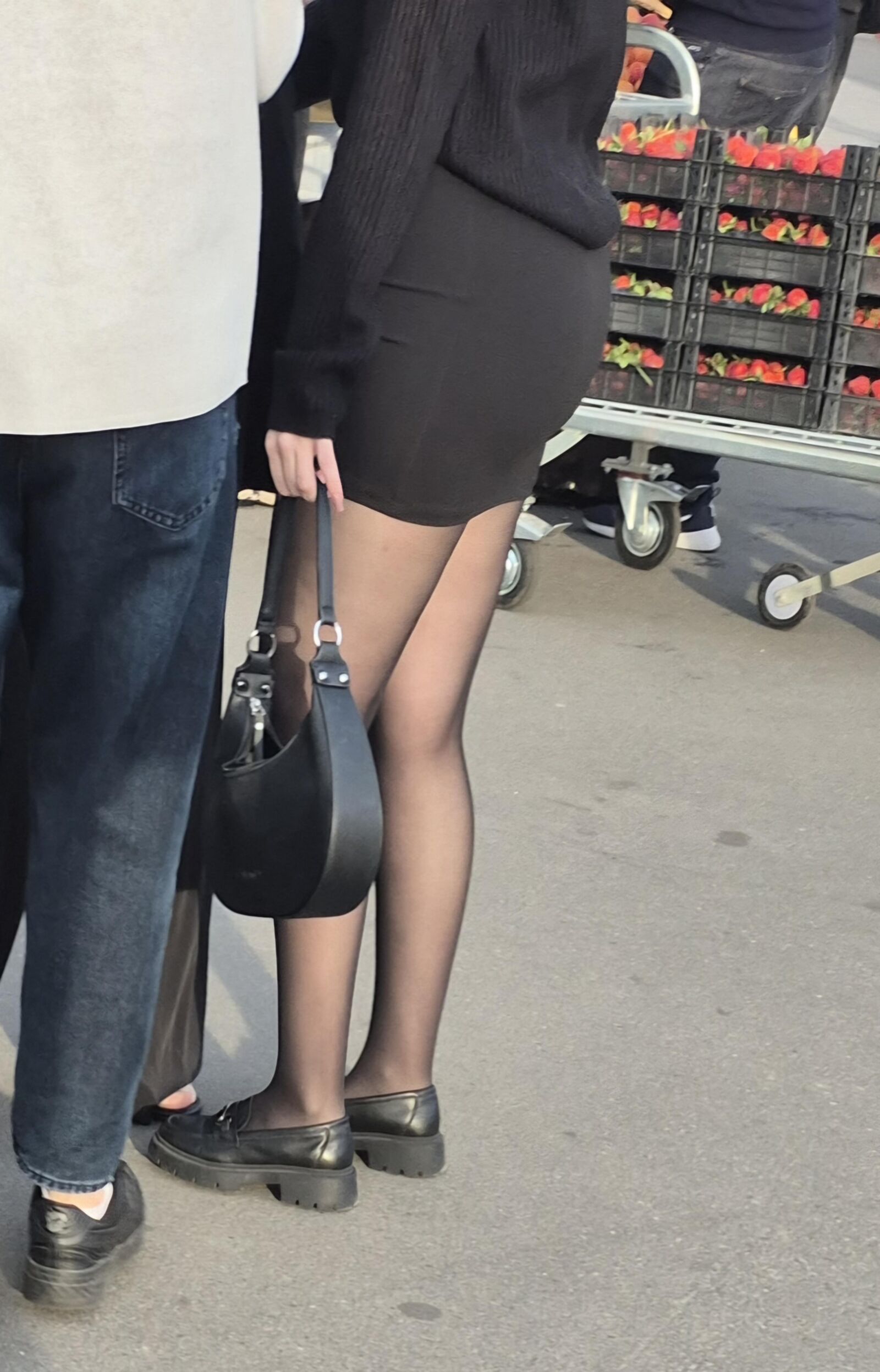 Girl in mini skirt and black pantyhose